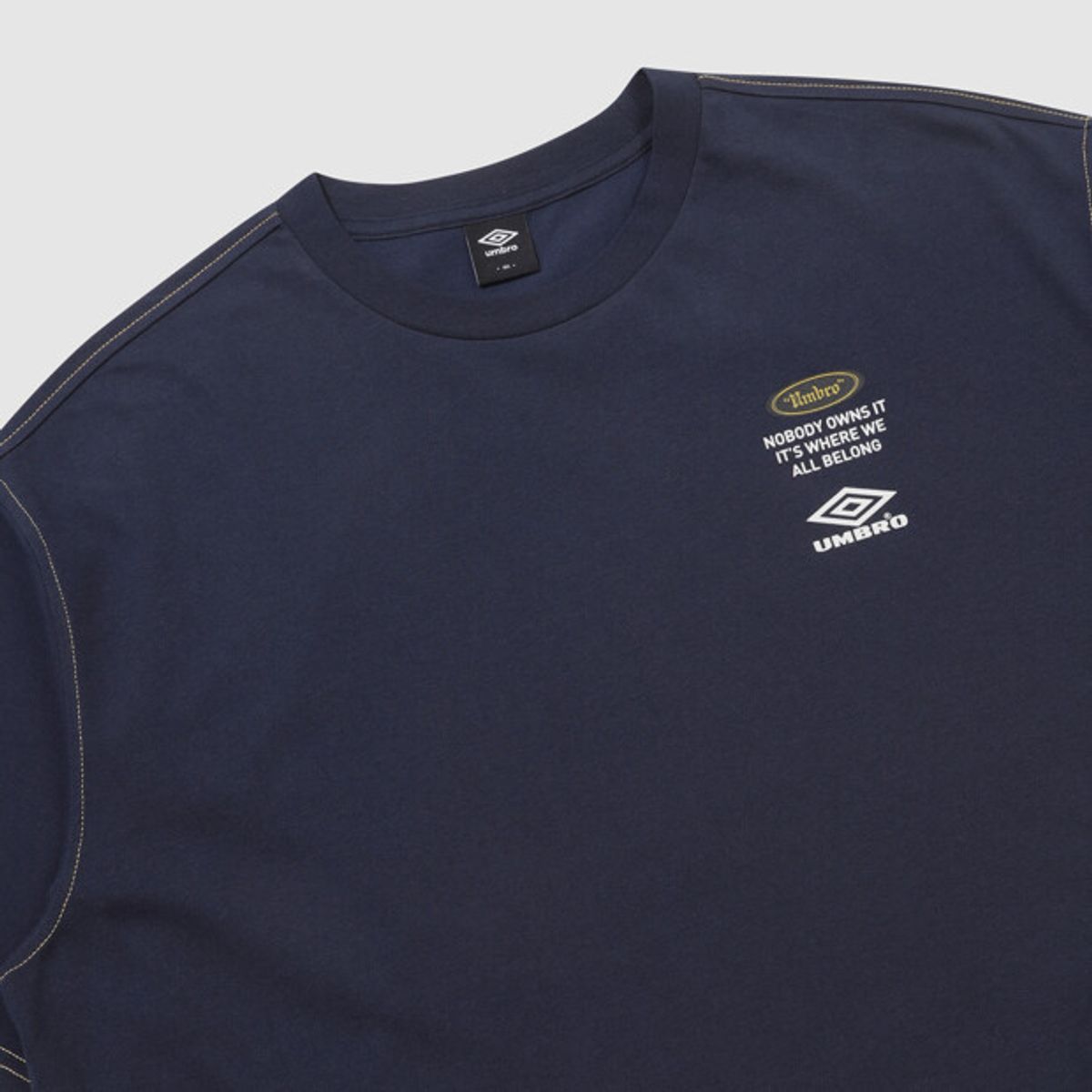 엄브로(UMBRO) 크리스피 타슬란 로고 반팔 티셔츠 네이비 UR224CRS59