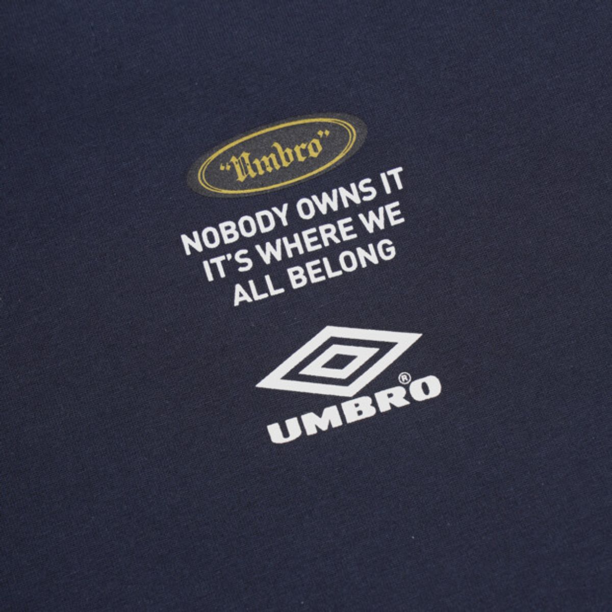엄브로(UMBRO) 크리스피 타슬란 로고 반팔 티셔츠 네이비 UR224CRS59