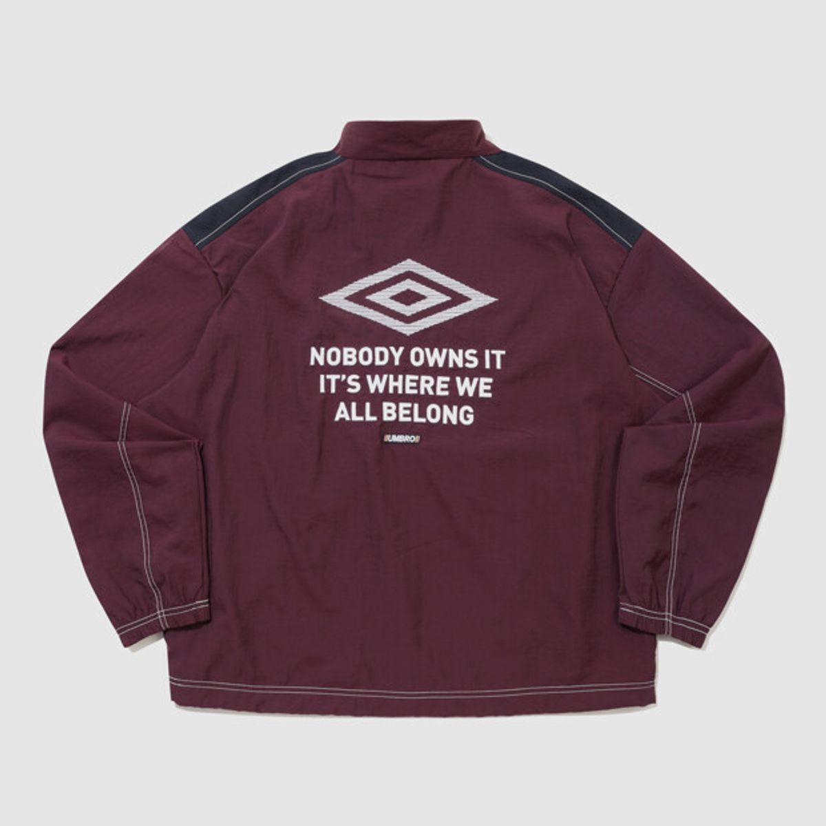 엄브로(UMBRO) 크리스피 타슬란 긴팔 바람막이 자켓 와인 UR224CJK59