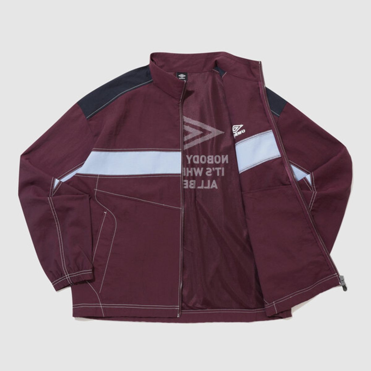 엄브로(UMBRO) 크리스피 타슬란 긴팔 바람막이 자켓 와인 UR224CJK59