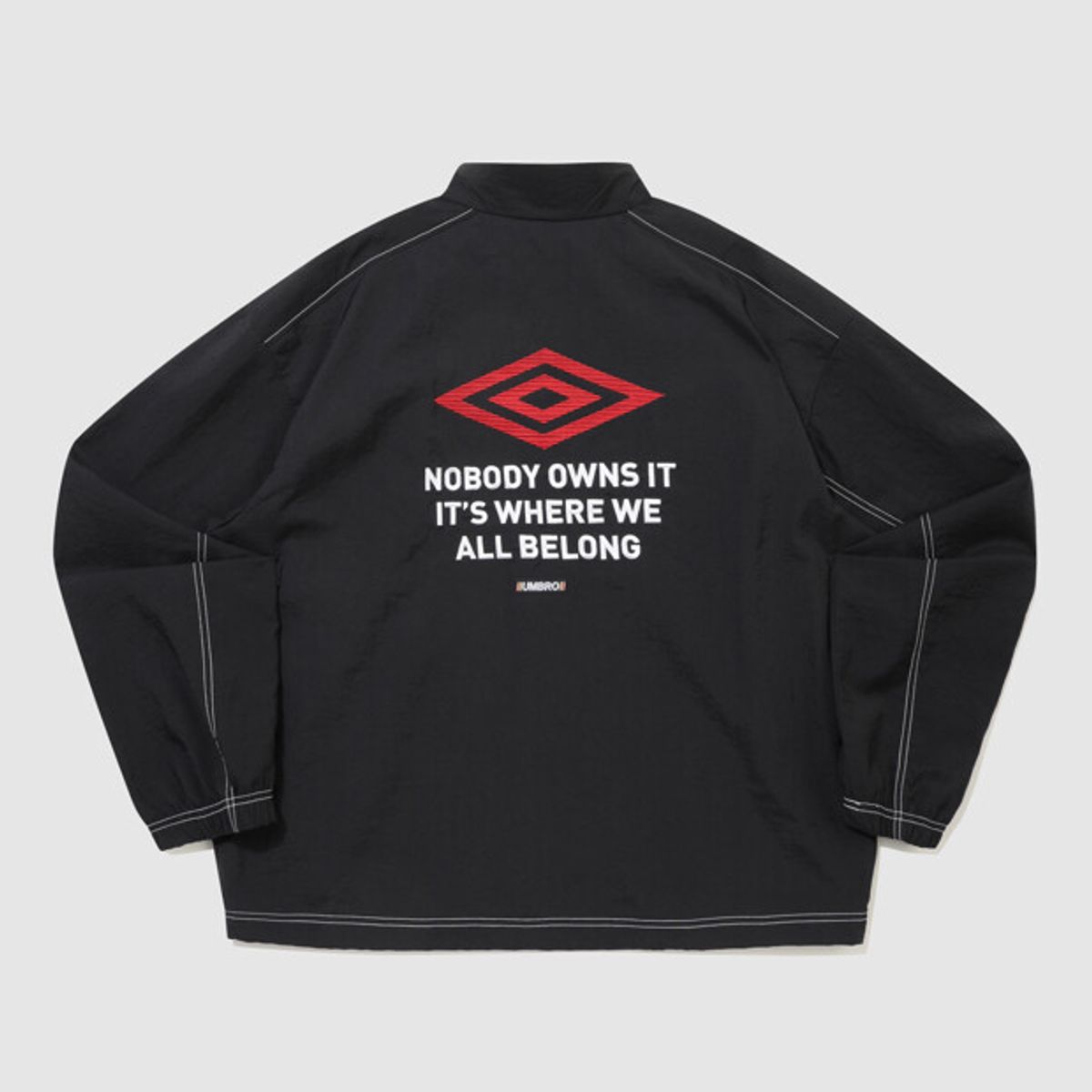 엄브로(UMBRO) 크리스피 타슬란 긴팔 바람막이 자켓 블랙 UR224CJK59