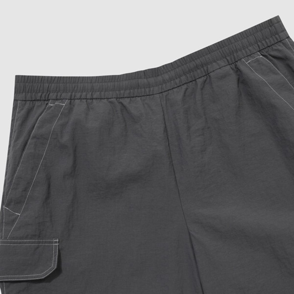 엄브로(UMBRO) 크리스피 타슬란 카고 4.5부 반바지 차콜 UR223CHP59