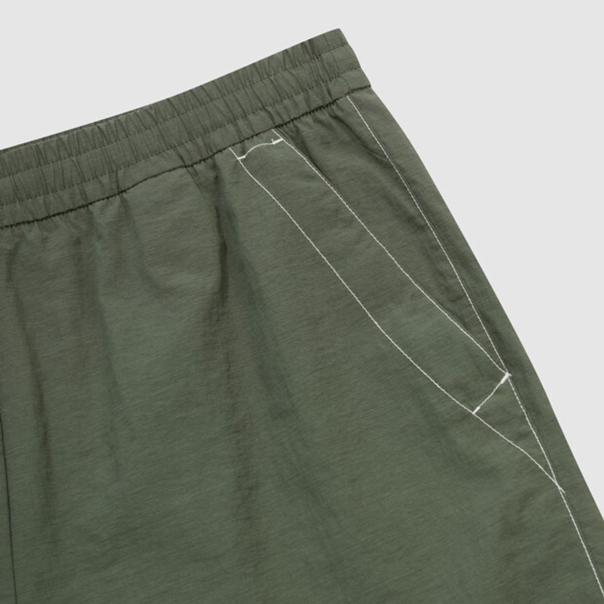 엄브로(UMBRO) 크리스피 타슬란 카고 4.5부 반바지 카키 UR223CHP59