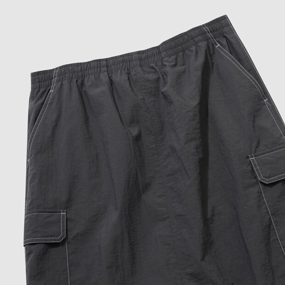 엄브로(UMBRO) 크리스피 타슬란 우먼스 카고 롱 스커트 차콜 UR222CSK59