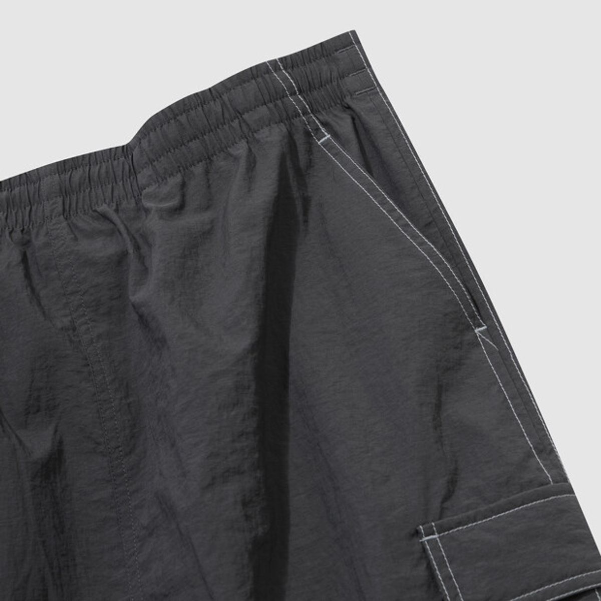 엄브로(UMBRO) 크리스피 타슬란 우먼스 카고 롱 스커트 차콜 UR222CSK59