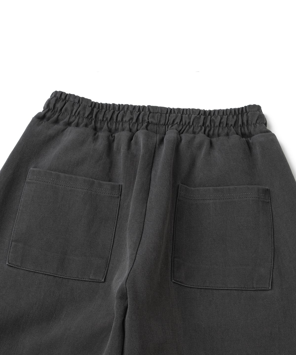 니티드(KNITTED) 피그먼트 커브드 트레이닝 팬츠 WASHING CHARCOAL