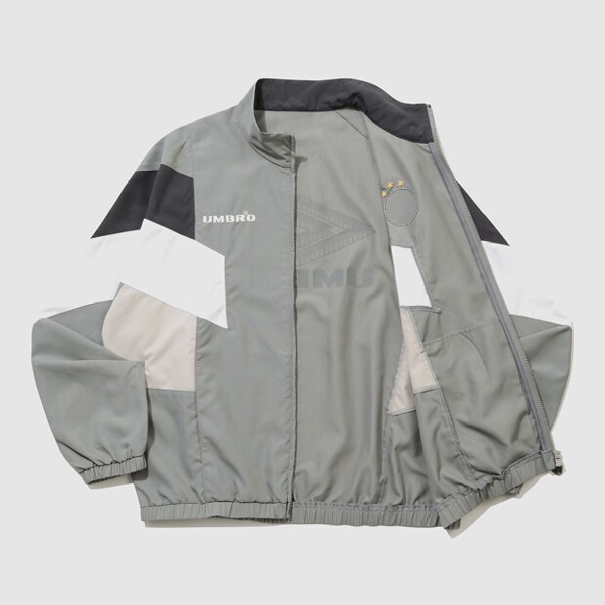 엄브로(UMBRO) HBL OG 컬러블럭 스탠넥 바람막이 자켓 그레이 UR221CJK56