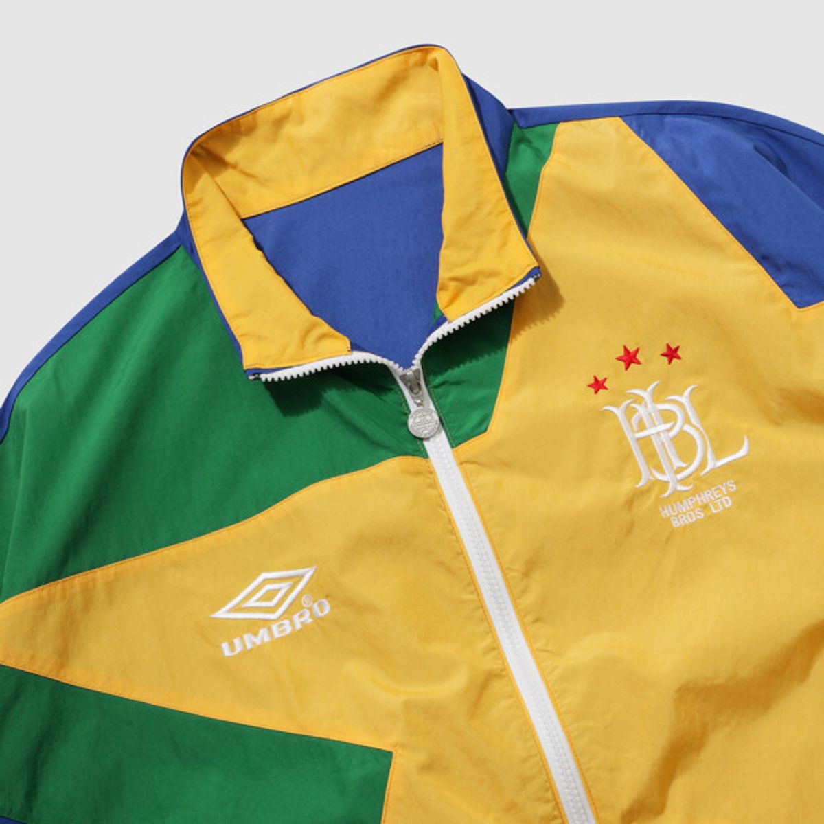 엄브로(UMBRO) HBL 스타챔프 별 스탠넥 바람막이 자켓 블루 UR221CJK52