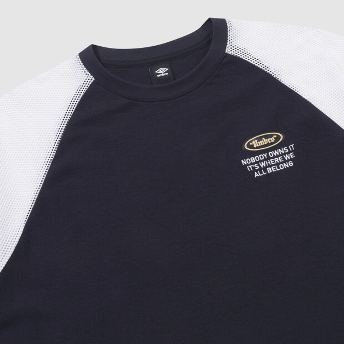 엄브로(UMBRO) 크리스피 타슬란 메쉬 하이브리드 반팔 티셔츠 네이비 UR211CRS50