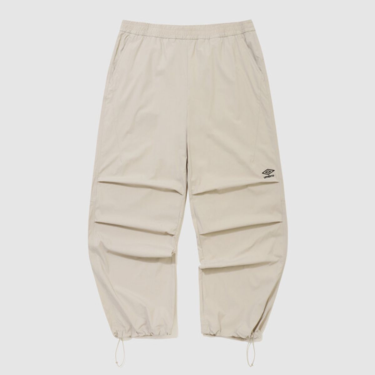 엄브로(UMBRO) 파라슈트 핀턱 2WAY 와이드 팬츠 베이지 UR223CPT51