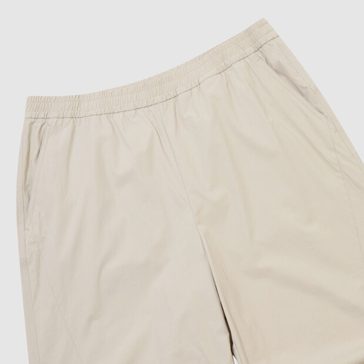 엄브로(UMBRO) 파라슈트 핀턱 2WAY 와이드 팬츠 베이지 UR223CPT51