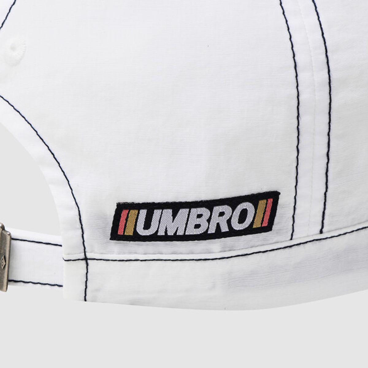 엄브로(UMBRO) 크리스피 타슬란 캡 화이트 UR221CCP51