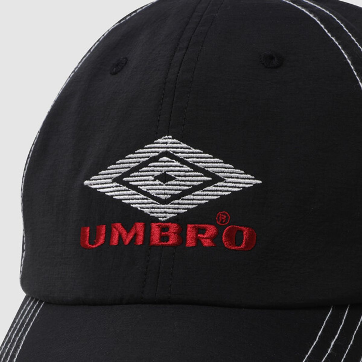 엄브로(UMBRO) 크리스피 타슬란 캡 블랙 UR221CCP51