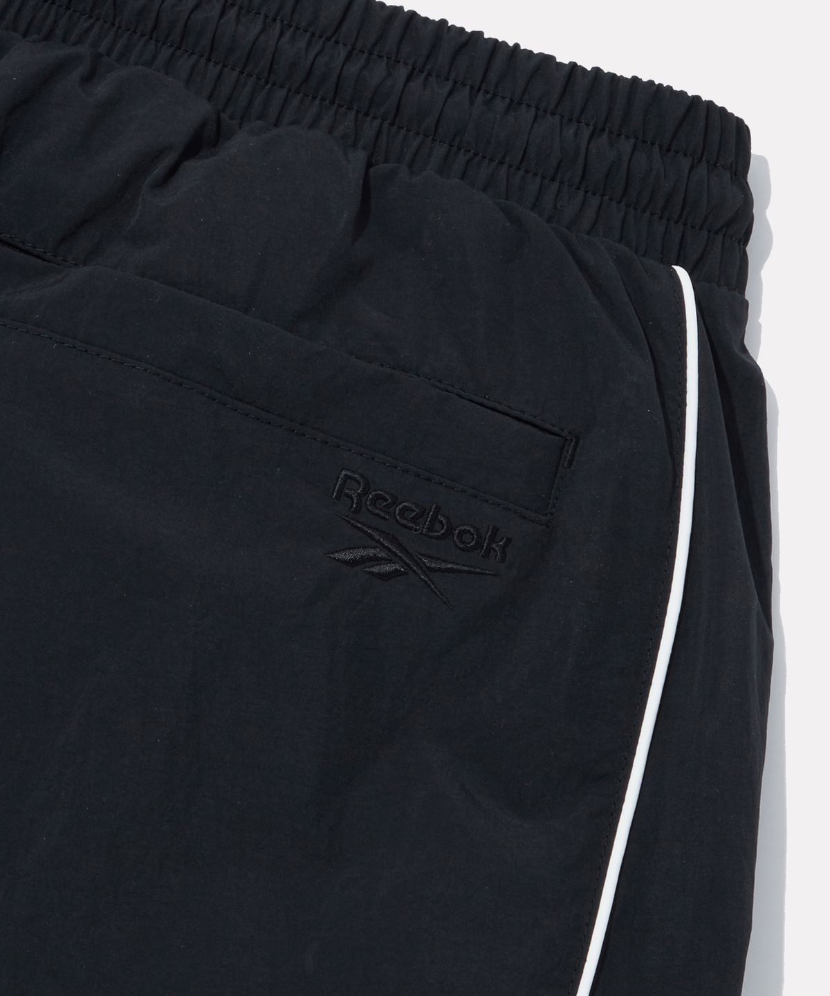 리복(REEBOK) 올커버 우븐 와이드 팬츠 (W) - 블랙