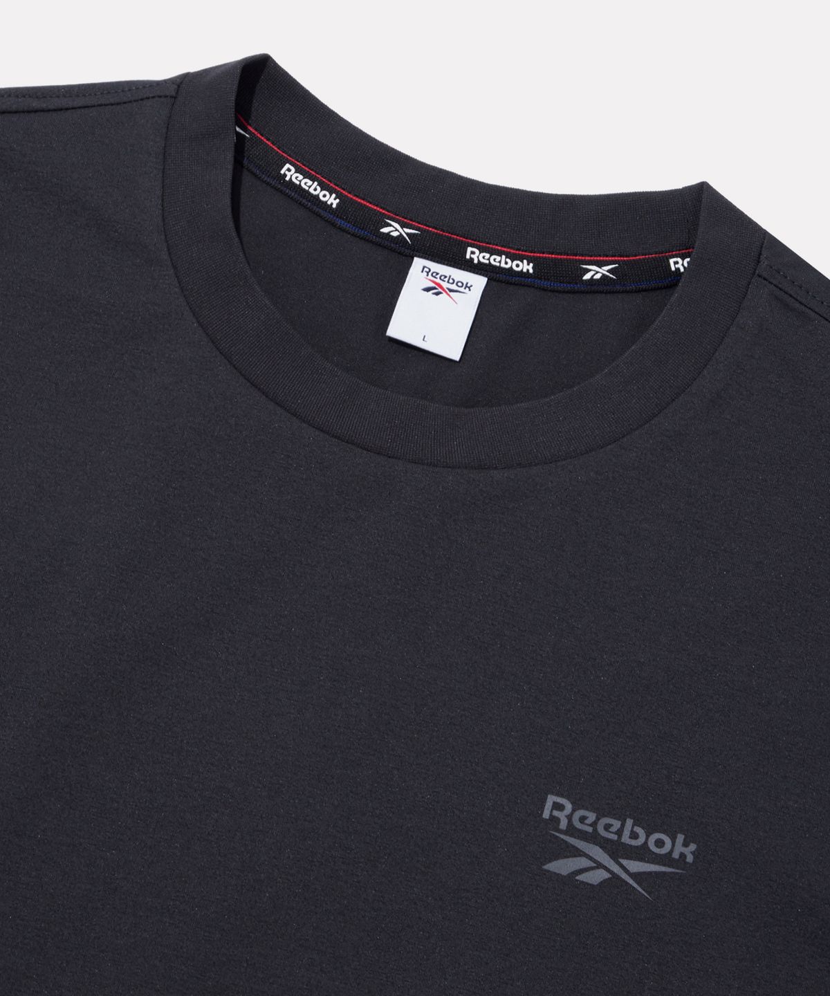 리복(REEBOK) 빅벡터 슬로건 프레쉬 반팔티 - 딥 차콜