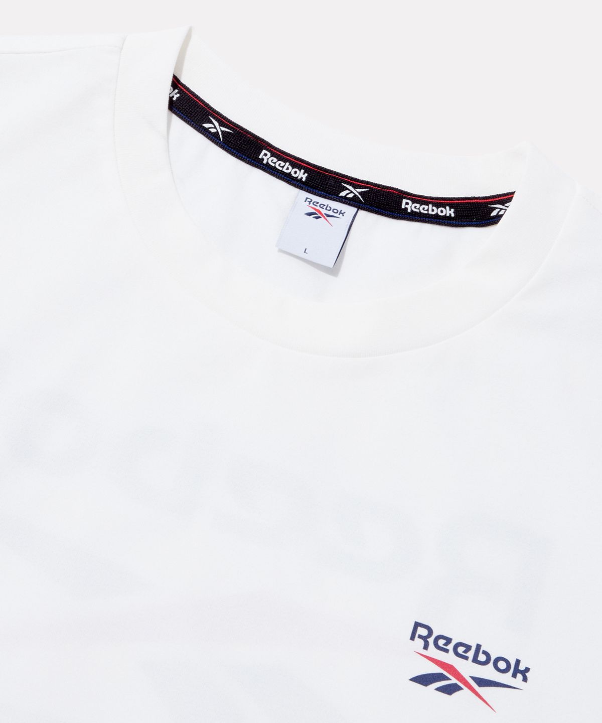 리복(REEBOK) 빅벡터 슬로건 프레쉬 반팔티 - 화이트