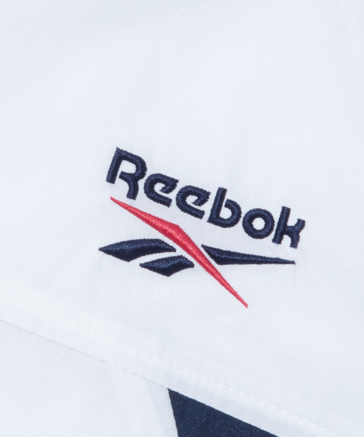 리복(REEBOK) 컬러블록 메쉬 매칭 윈드브레이커 - 화이트:네이비