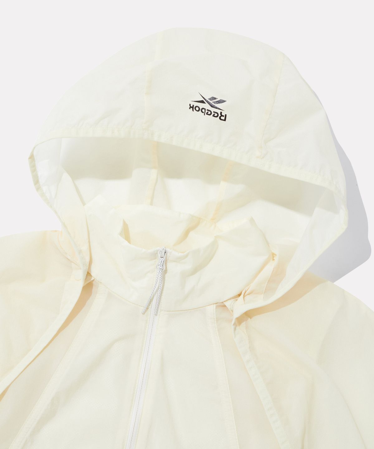 리복(REEBOK) 디테처블 경량 윈드브레이커 (W) - 버터