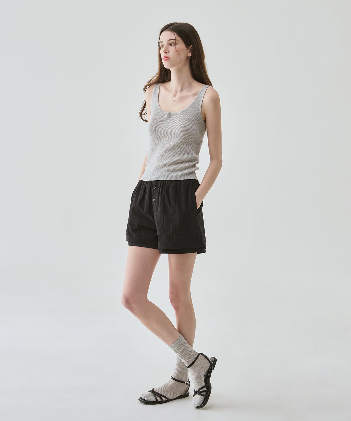 드로우핏 우먼(DRAWFIT WOMEN) 브리즈 슬리브리스 니트 탑 [BLACK]