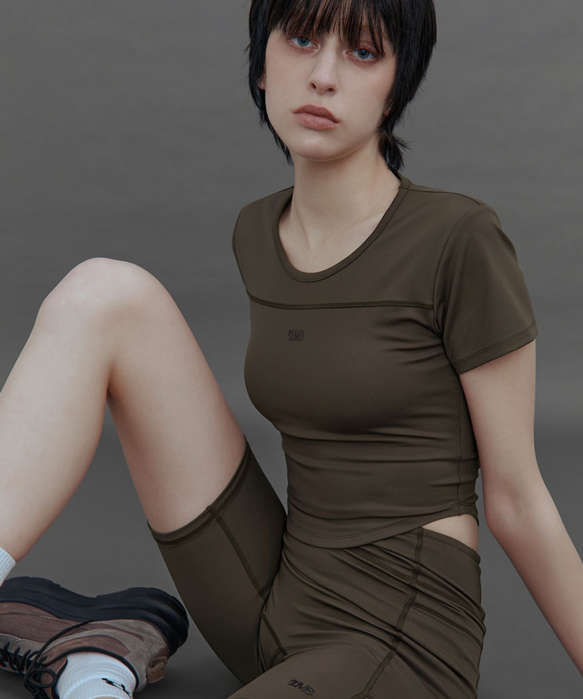 트리밍버드(TREEMINGBIRD) TMB Active Open-Back Top [ Brown ]