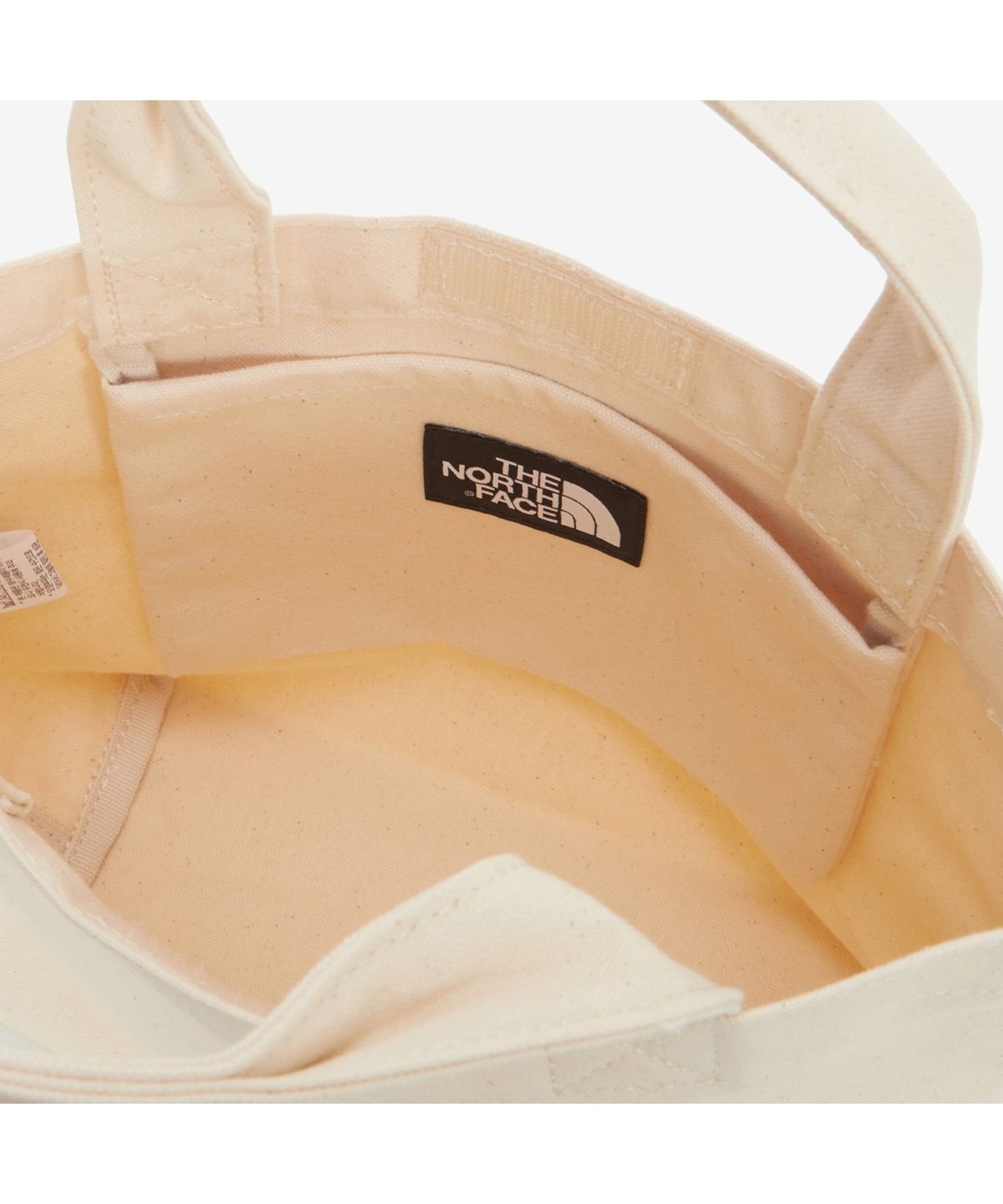 노스페이스(THE NORTH FACE) NN2PS26A 티앤에프 로고 코튼 백 스몰 CREAM