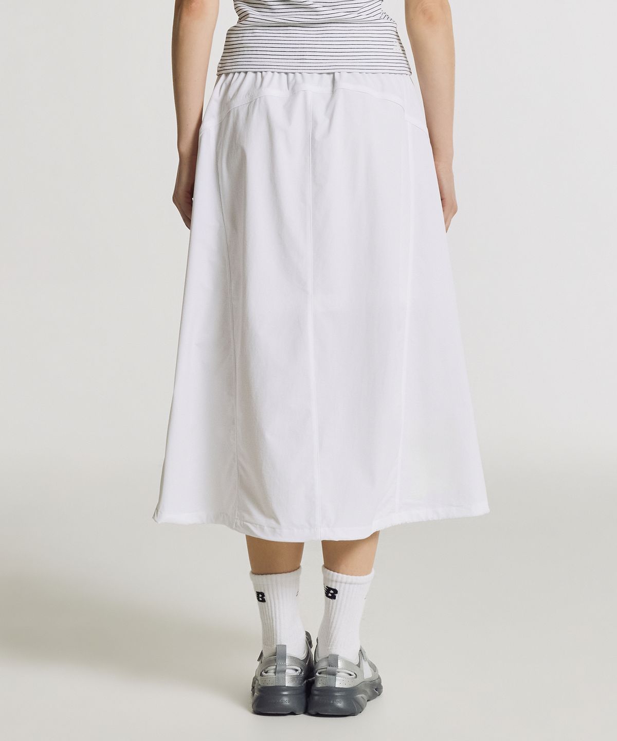 뉴발란스(NEW BALANCE) NBNWG3W612 / WOMEN FROZEN 우븐 스트레치 롱 스커트 (WHITE)