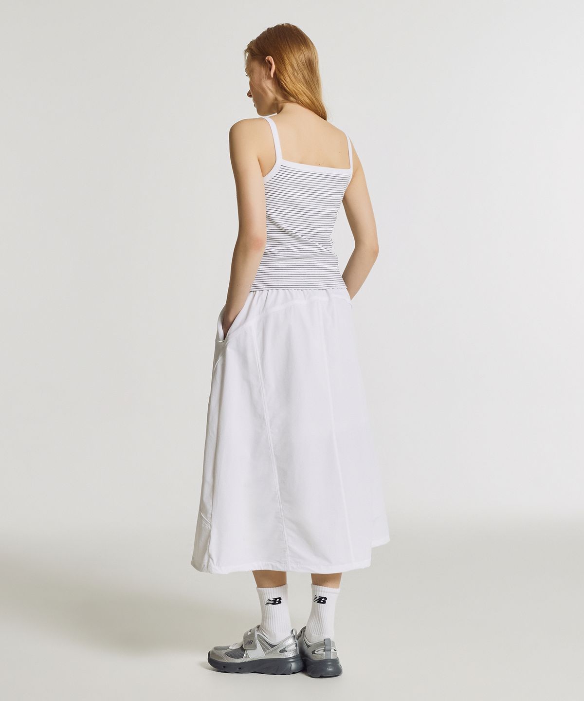 뉴발란스(NEW BALANCE) NBNWG3W612 / WOMEN FROZEN 우븐 스트레치 롱 스커트 (WHITE)
