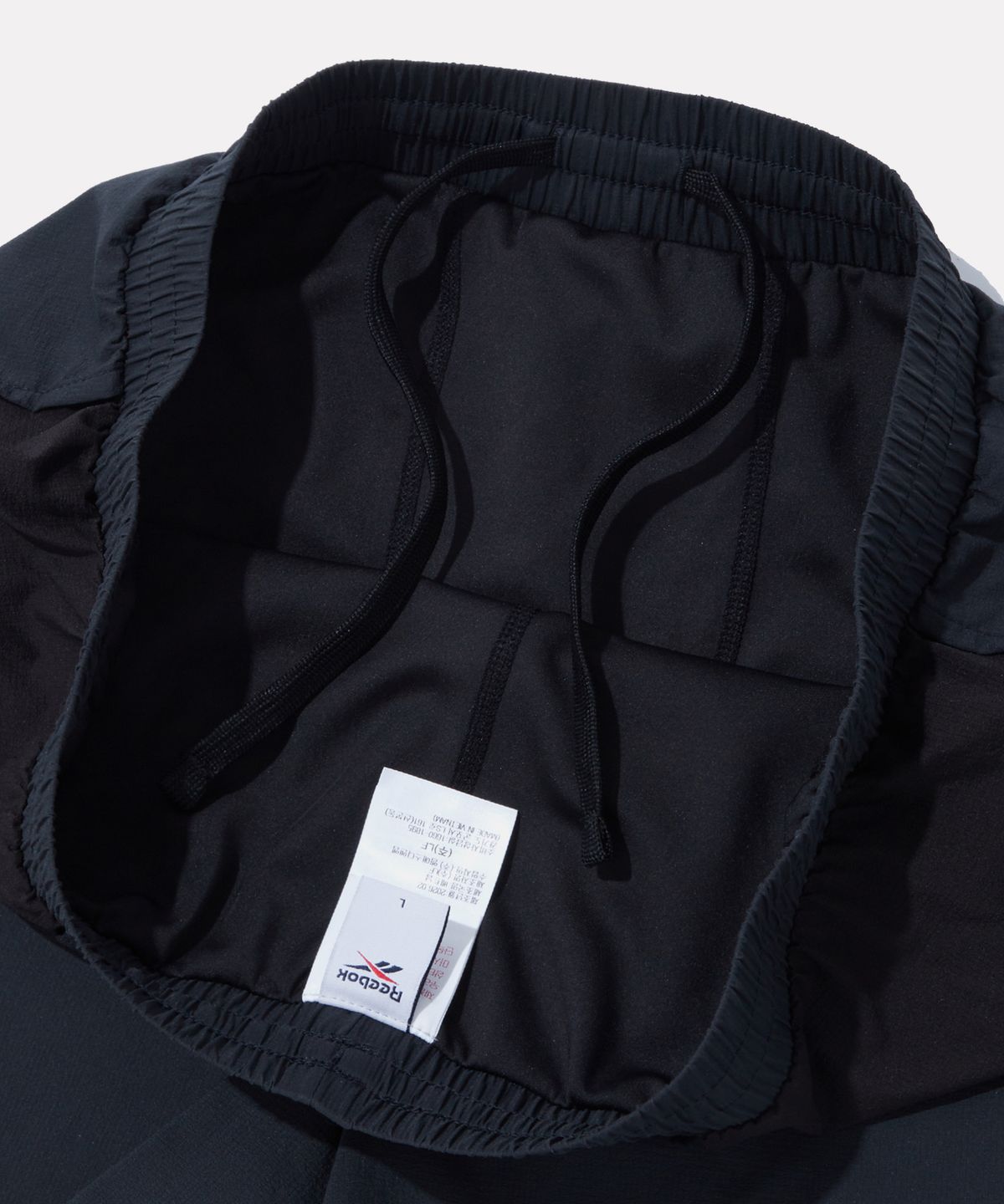 리복(REEBOK) 퍼포먼스 2in1 쇼츠 - 딥 차콜