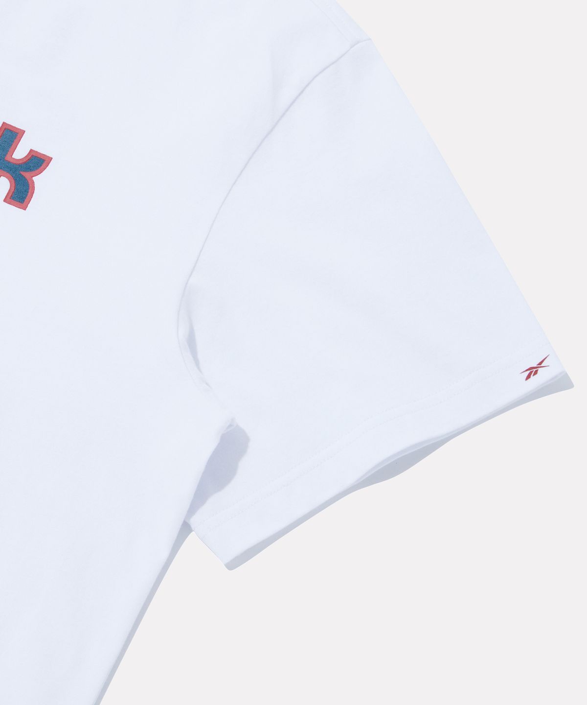 리복(REEBOK) [리복x발란사] 레터링 로고 반팔티 - 화이트