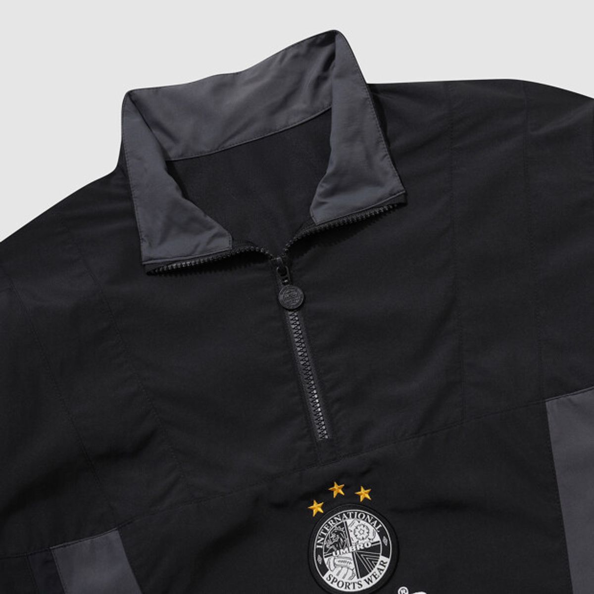 엄브로(UMBRO) HBL OG 컬러블럭 반팔 스탠넥 아노락 블랙 UR221CWT56