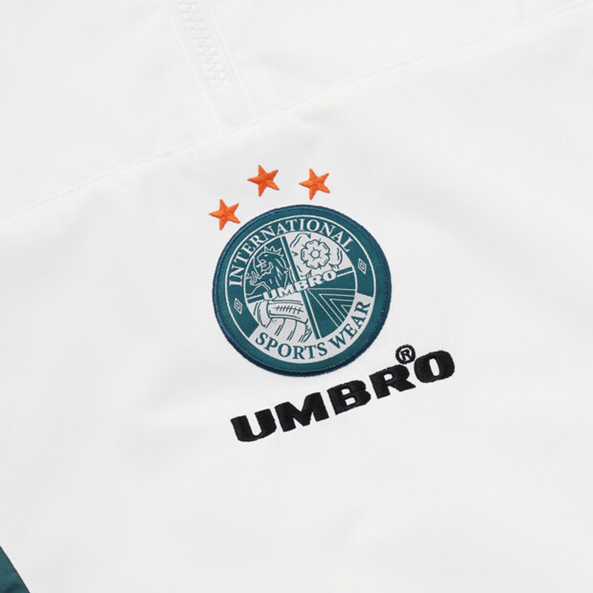엄브로(UMBRO) HBL OG 컬러블럭 반팔 스탠넥 아노락 아이보리 UR221CWT56