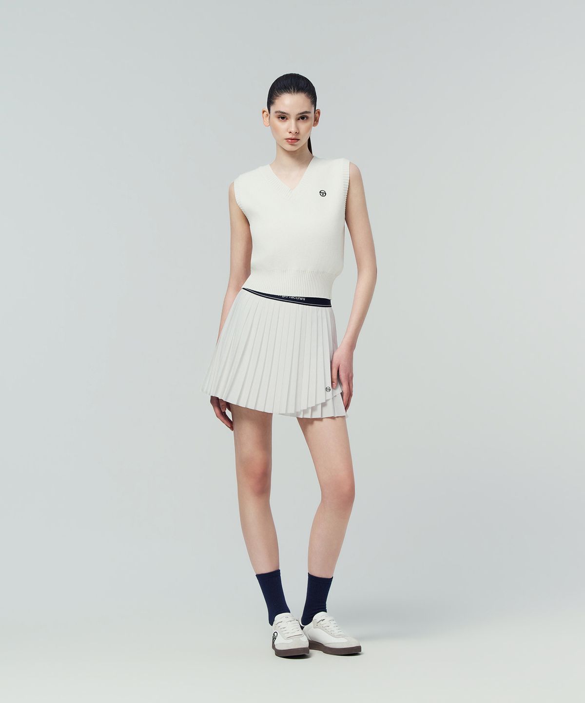 세르지오 타키니(SERGIO TACCHINI) W 플라잉 언밸런스 플리츠 스커트 (White)