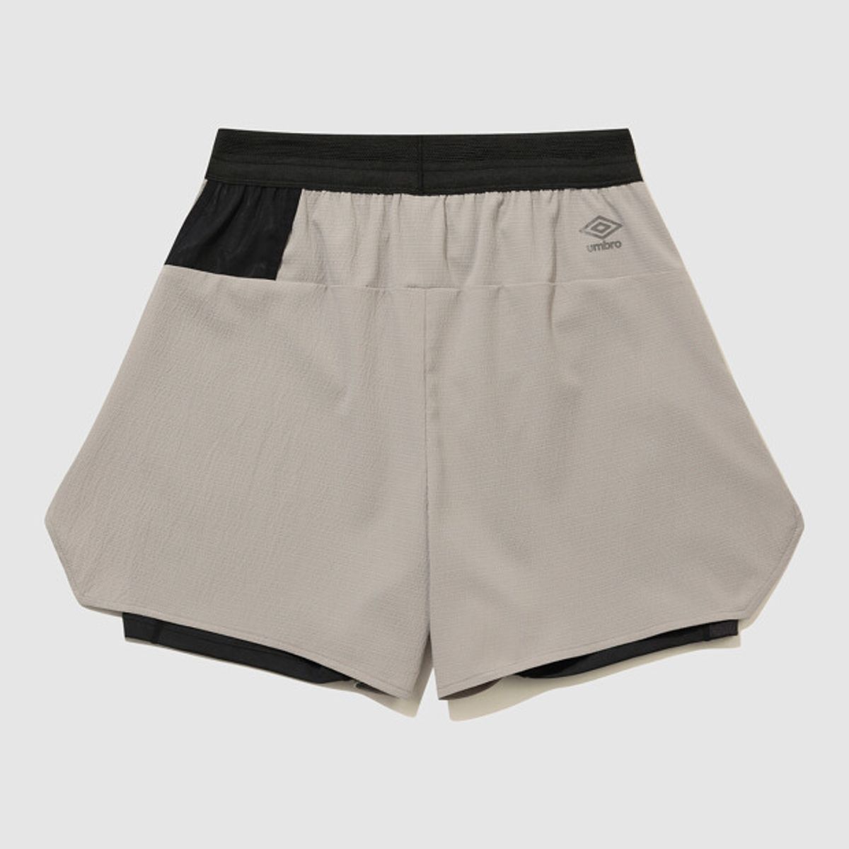 엄브로(UMBRO) 슬로우킥 경량 레깅스 투인원(2IN1) 3부 반바지 베이지 UR221SHP54