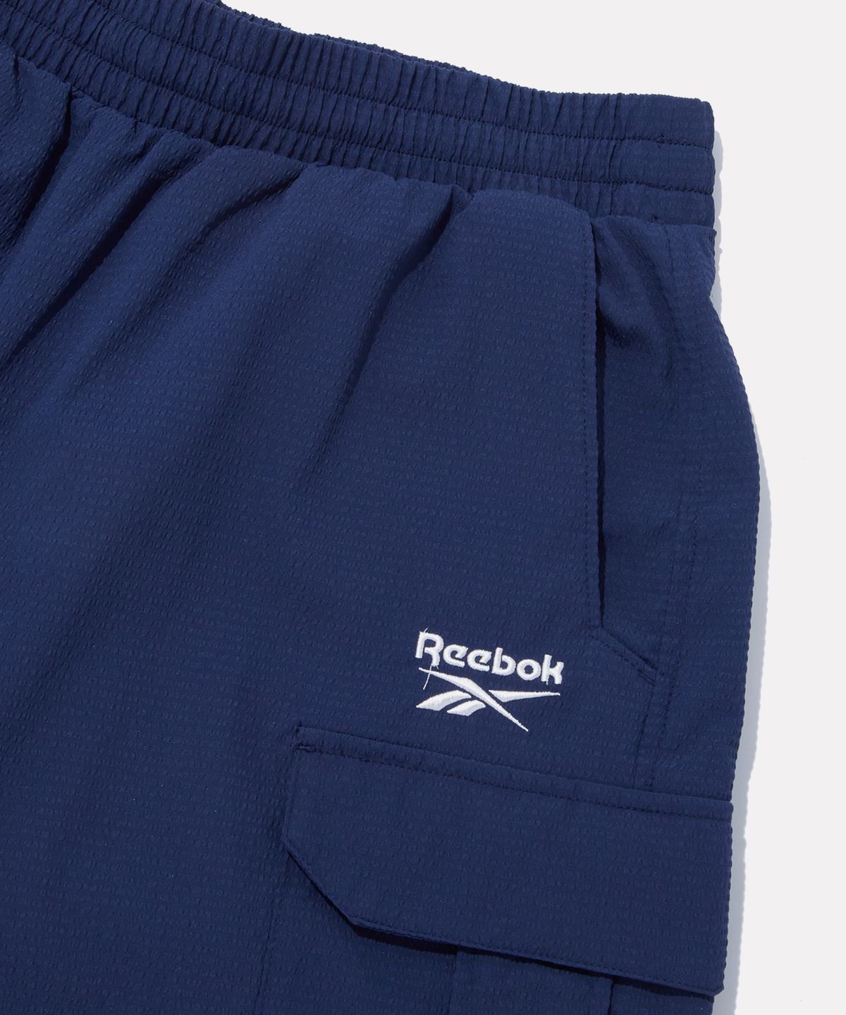 리복(REEBOK) 시어서커 카고 쇼츠 - 네이비