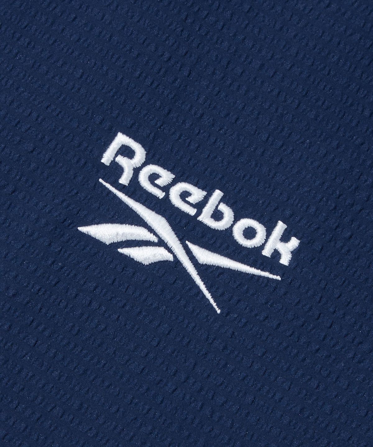 리복(REEBOK) 시어서커 반팔 피스테 - 네이비