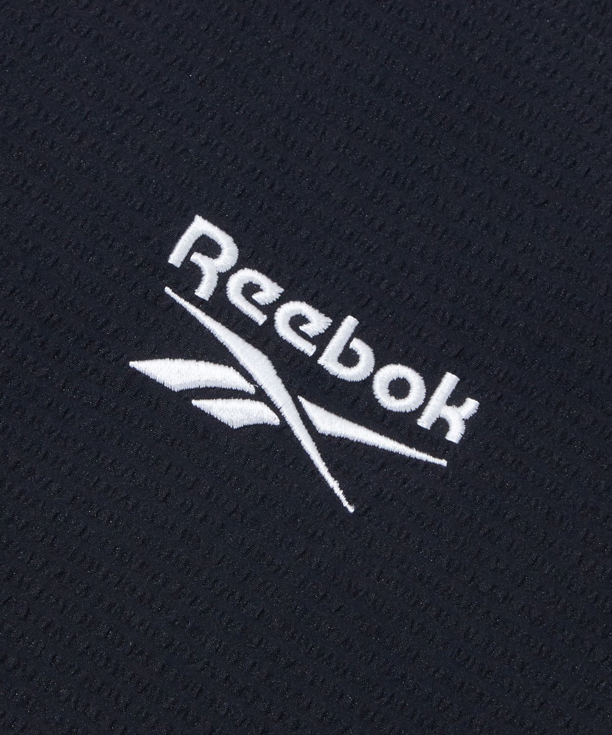 리복(REEBOK) 시어서커 반팔 피스테 - 블랙