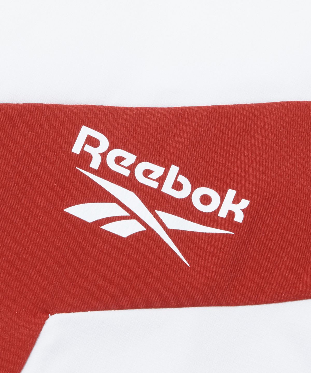 리복(REEBOK) 아이스실드 반팔 아노락 - 화이트:네이비