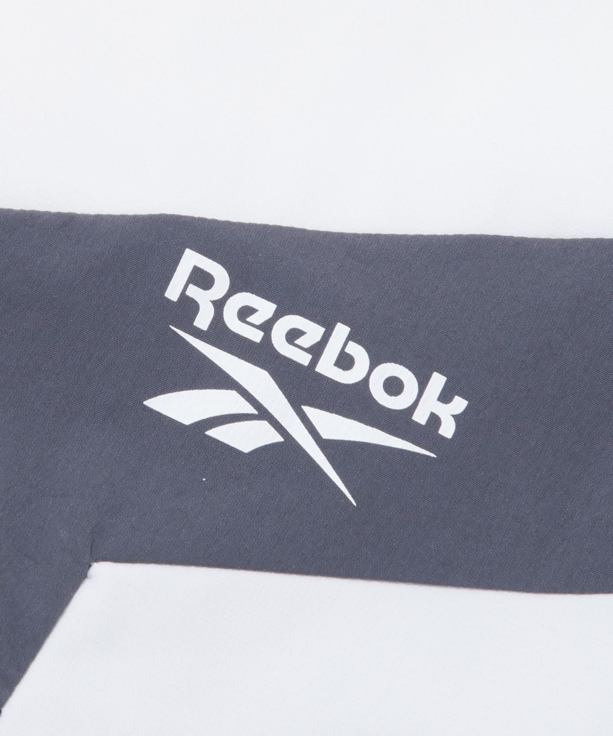 리복(REEBOK) 아이스실드 반팔 아노락 - 블랙:화이트