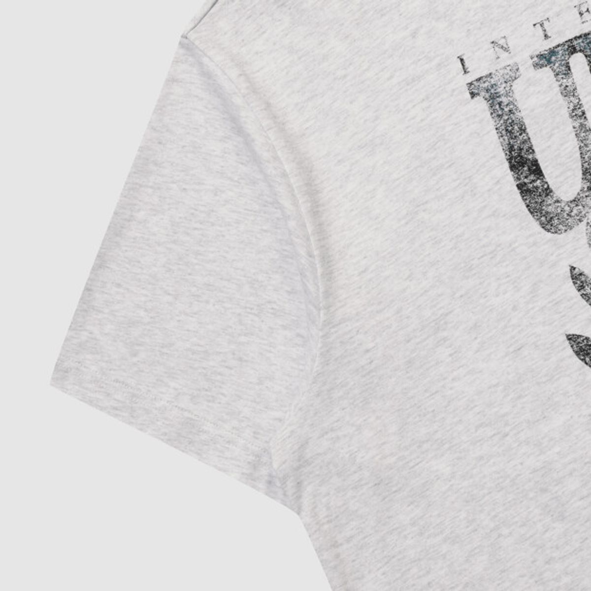 엄브로(UMBRO) 콘크리트 블룸 스프레이 이펙트 반팔 티셔츠 라이트 그레이 UR221CRS58