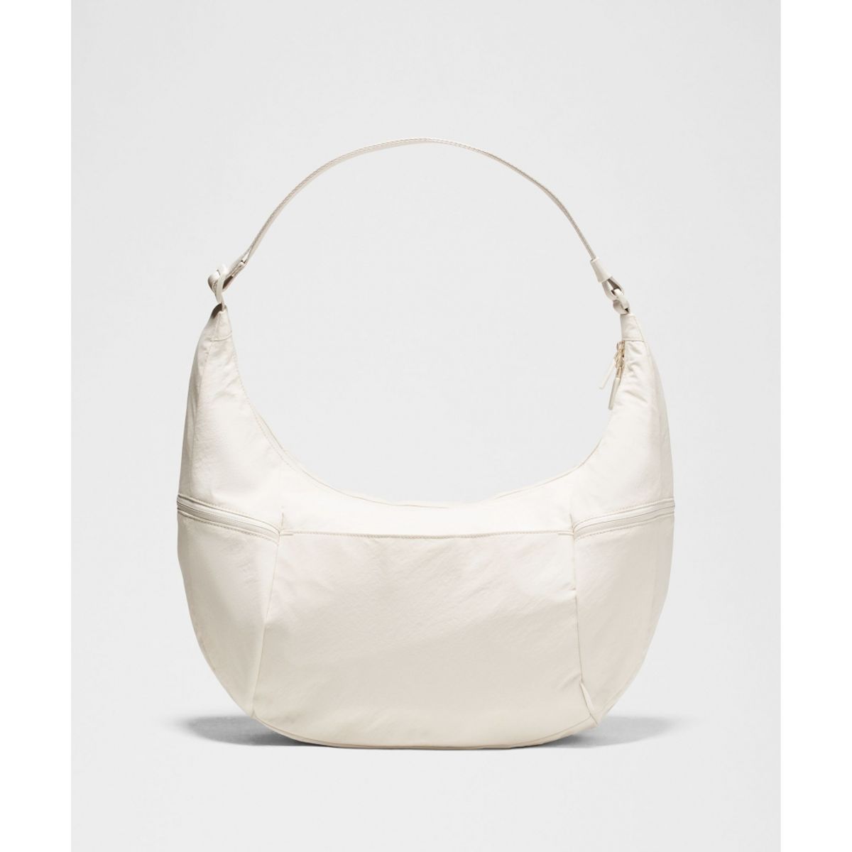 룰루레몬(LULULEMON) 라지 슬라우치 슬링백 13L  LTIV GOLD
