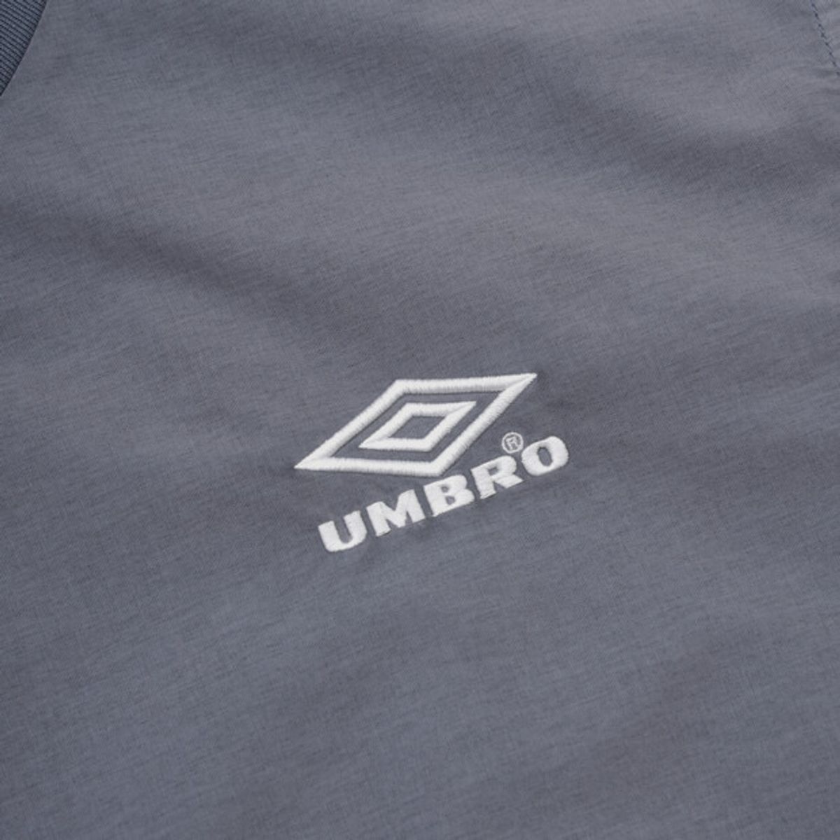 엄브로(UMBRO) 콘크리트 블룸 다잉 우븐 반팔 피스테 블루 UR221CWT55
