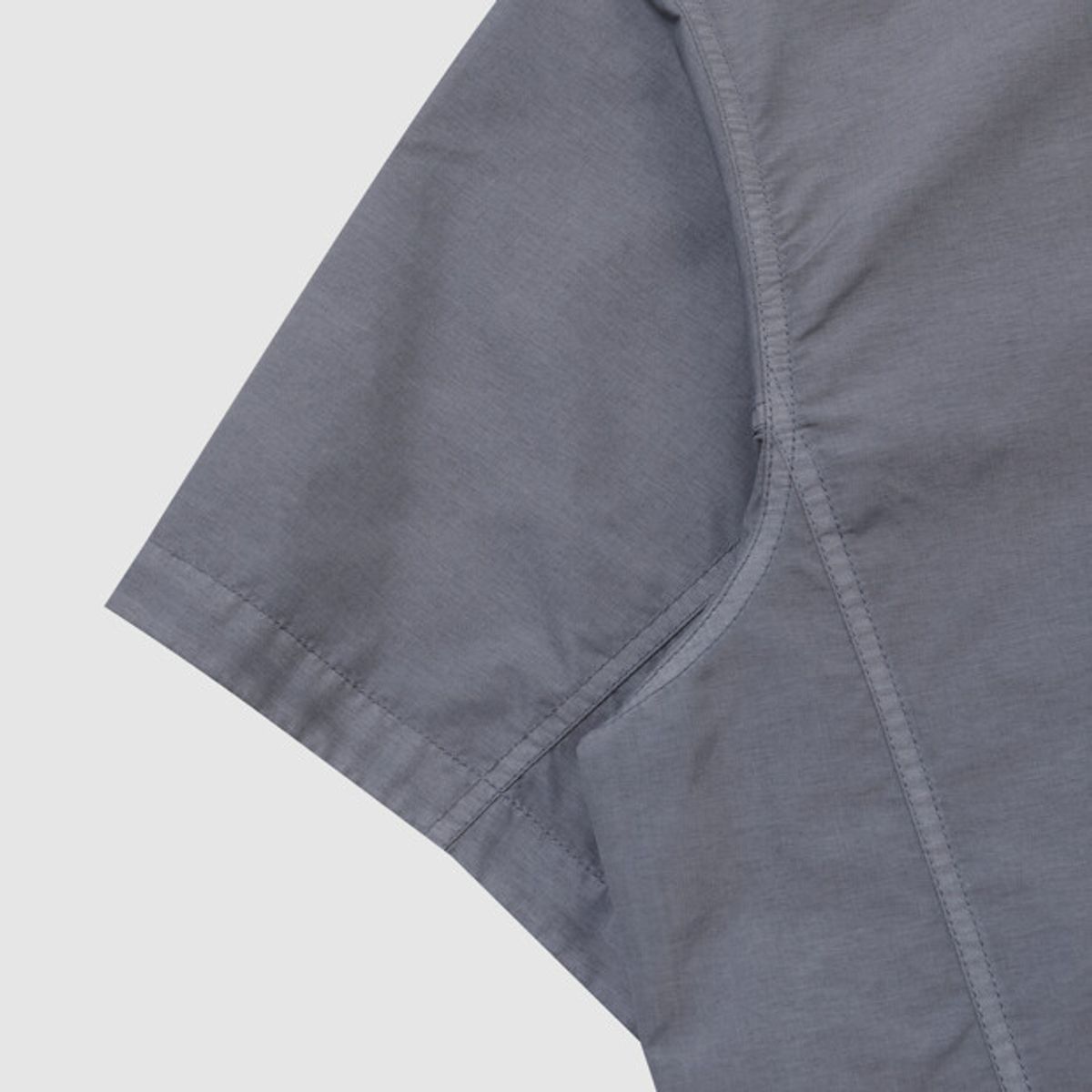 엄브로(UMBRO) 콘크리트 블룸 다잉 우븐 반팔 피스테 블루 UR221CWT55