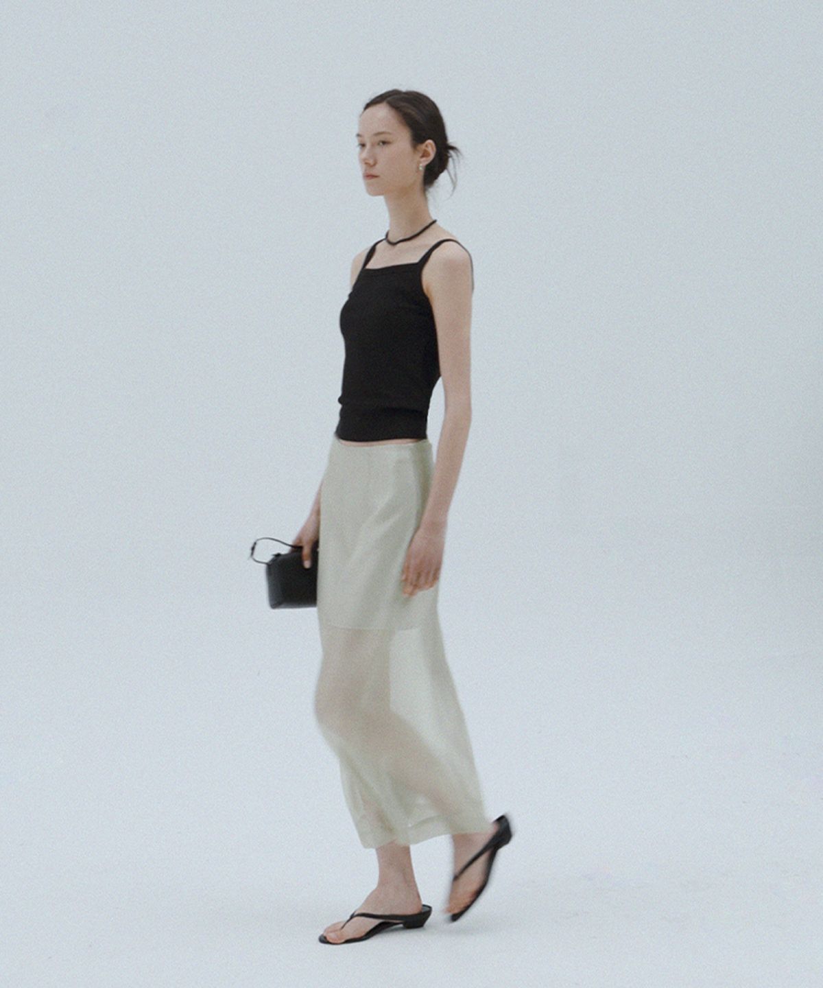 퀸스래빗(Q'SRB) Sheer Glossy Mid-Length Skirt