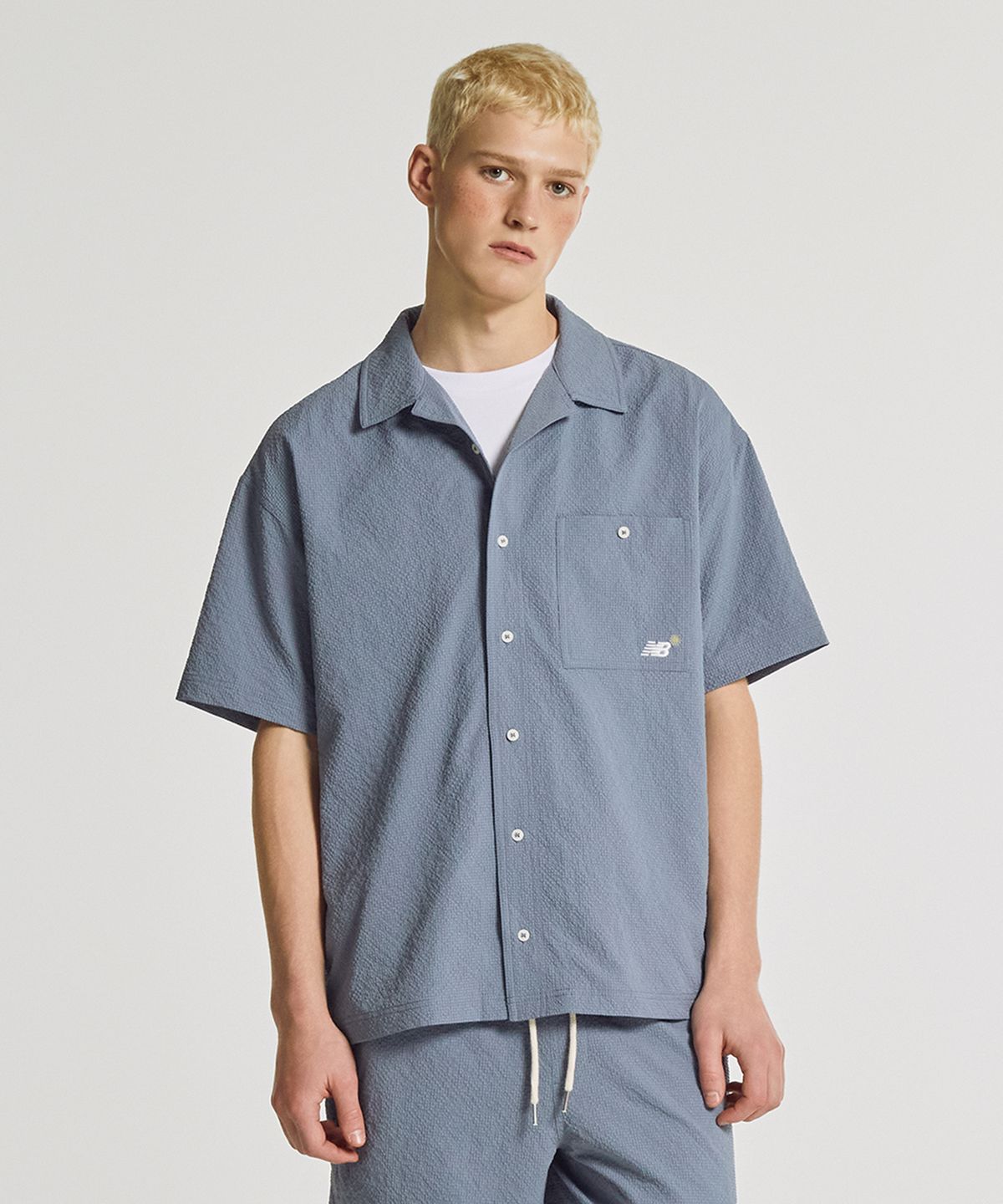뉴발란스(NEW BALANCE) NBNAGCA013 / UNI 선 키스드 반팔셔츠 (INDIGO)