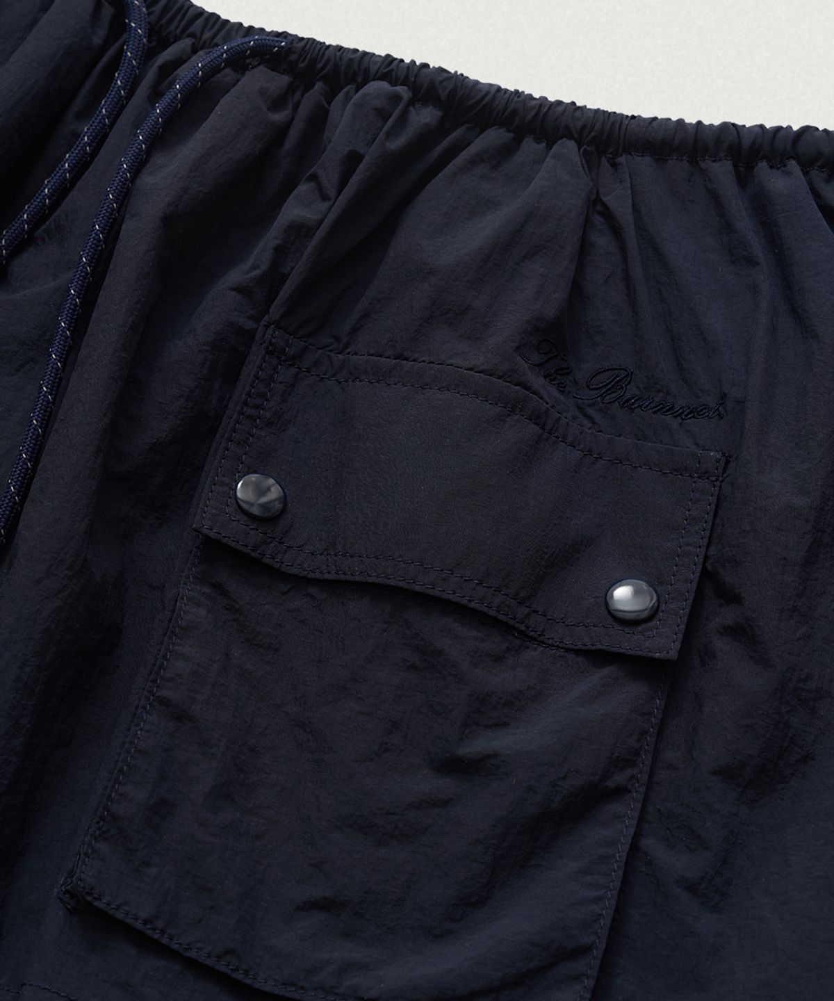 더바넷(THEBARNNET) Leon Wind Drawstring Skirt_Navy