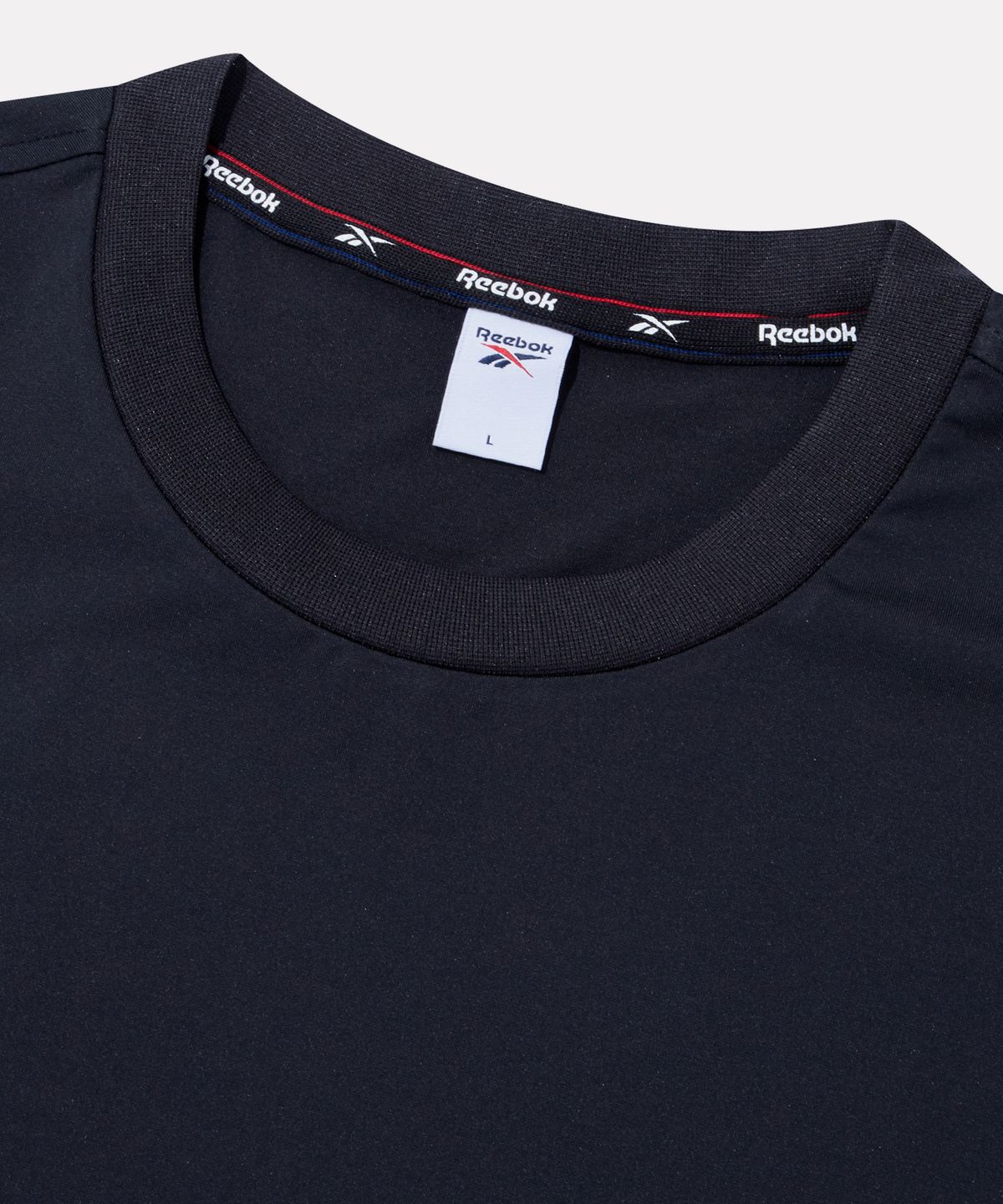 리복(REEBOK) 스웰 그래픽 래쉬가드 겸용 반팔티 - 블랙
