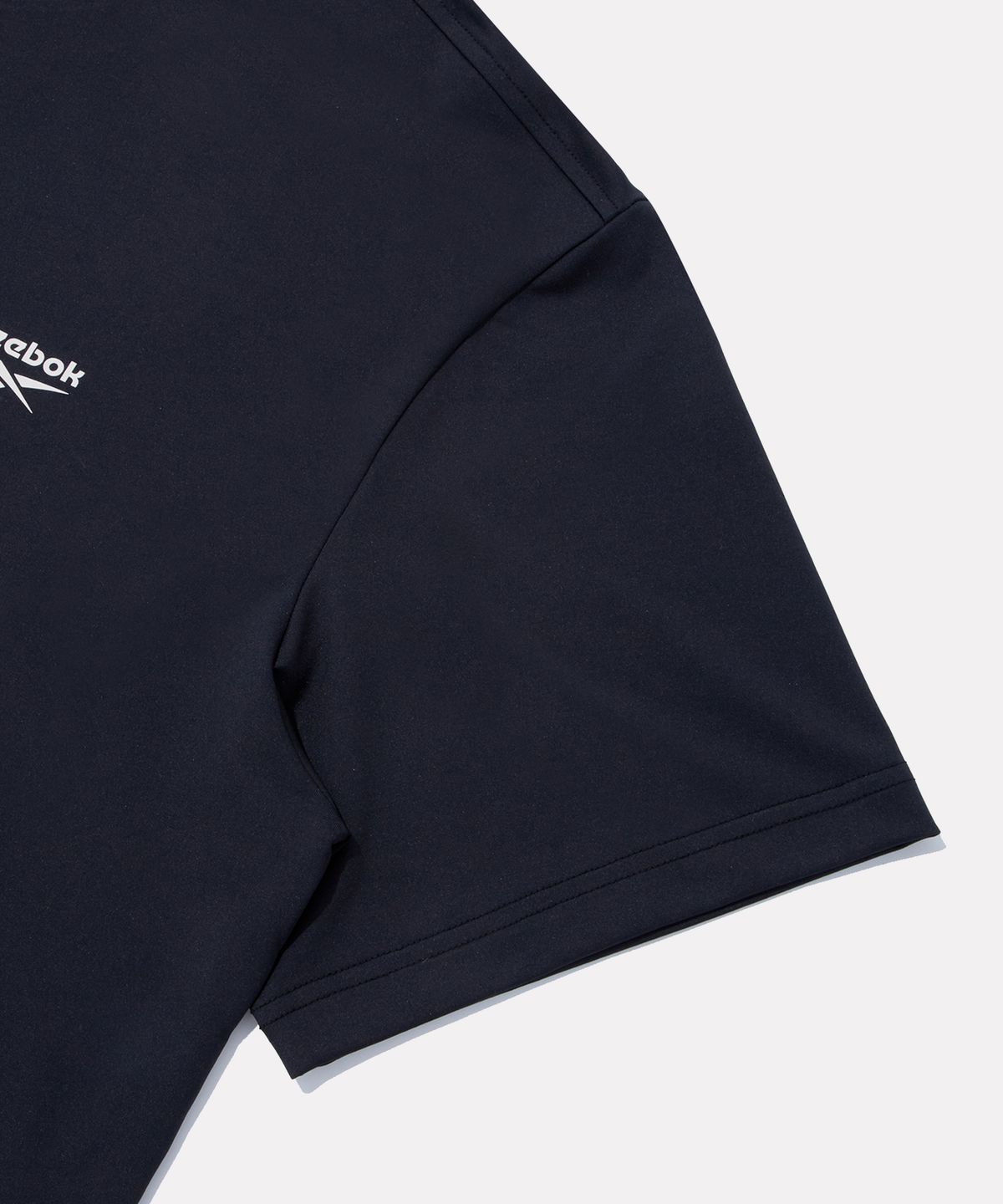 리복(REEBOK) 스웰 그래픽 래쉬가드 겸용 반팔티 - 블랙