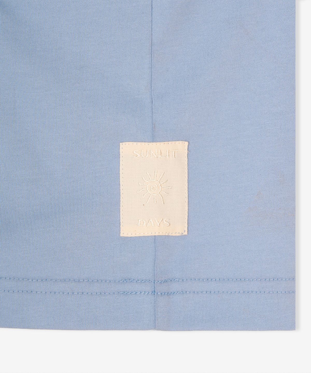 뉴발란스(NEW BALANCE) NBNEGCA023 / UNI 선 키스드 카프리 반팔티 (BLUE)