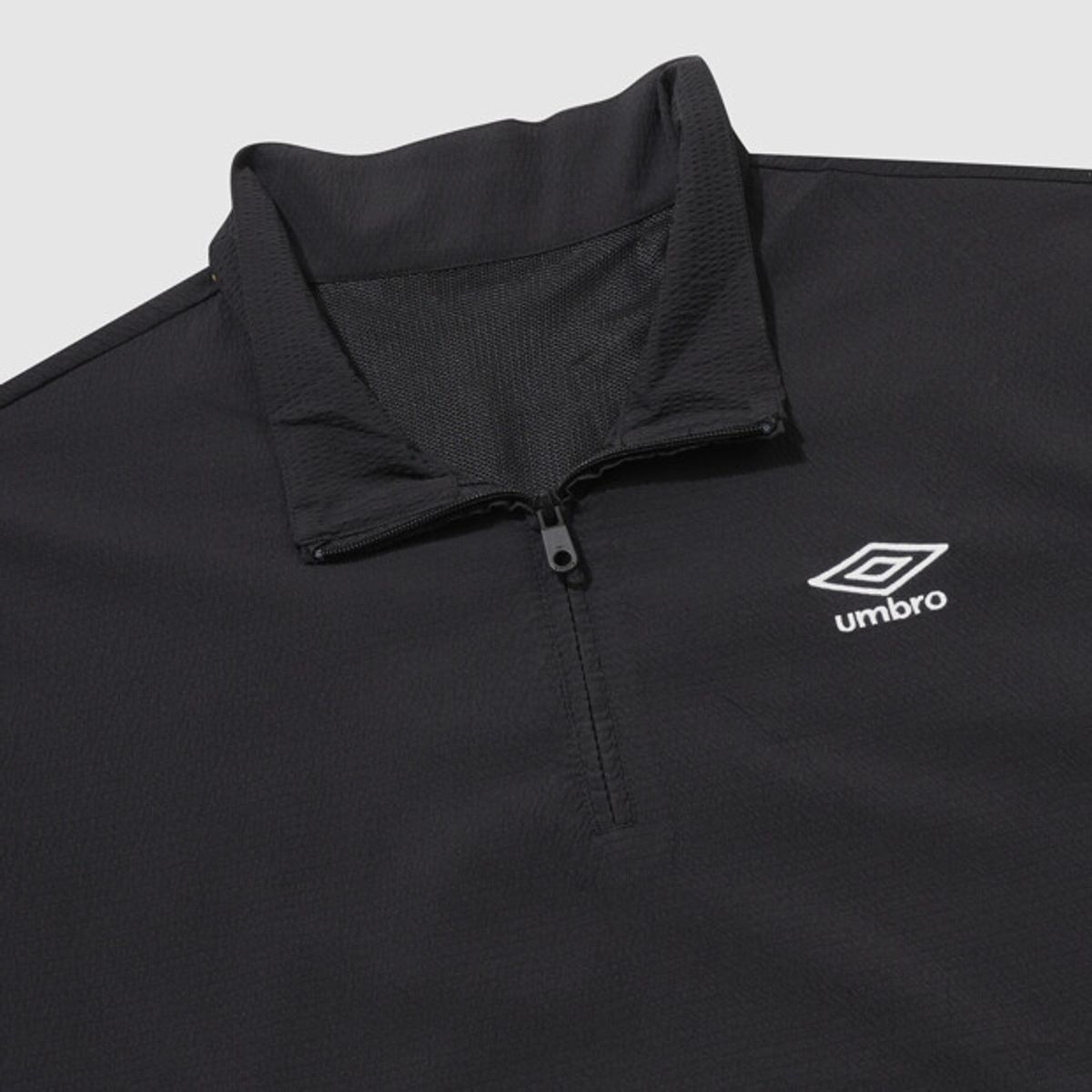 엄브로(UMBRO) 시어서커 반팔 스탠넥 아노락 블랙 UR221CWT63