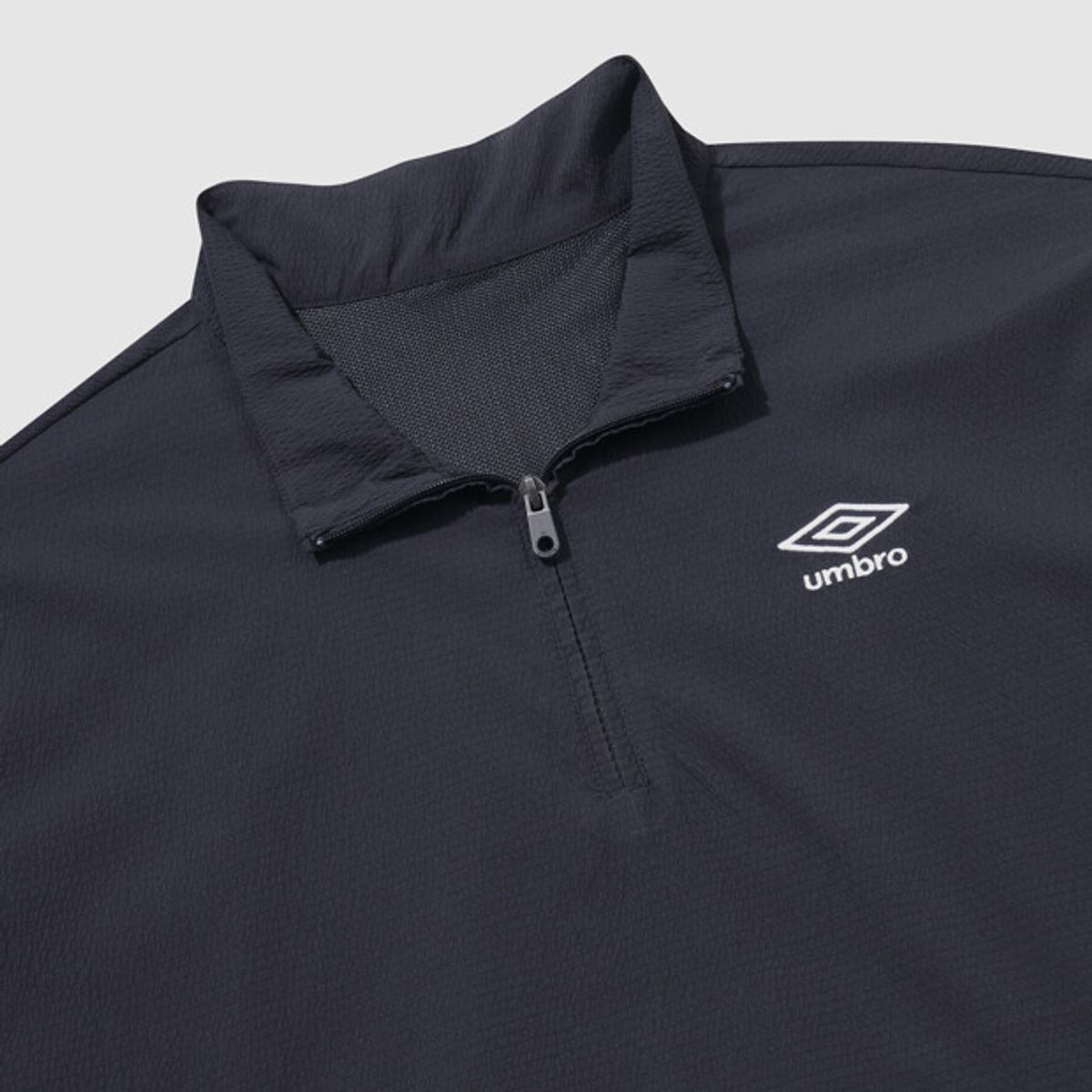 엄브로(UMBRO) 시어서커 반팔 스탠넥 아노락 네이비 UR221CWT63